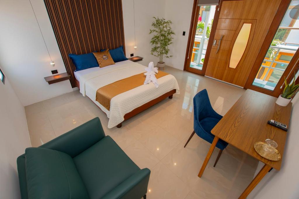 Postel nebo postele na pokoji v ubytování Blue Marlin Galápagos, Hotel & SPA