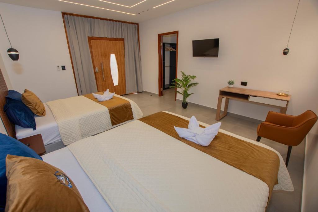 Postel nebo postele na pokoji v ubytování Blue Marlin Galápagos, Hotel & SPA