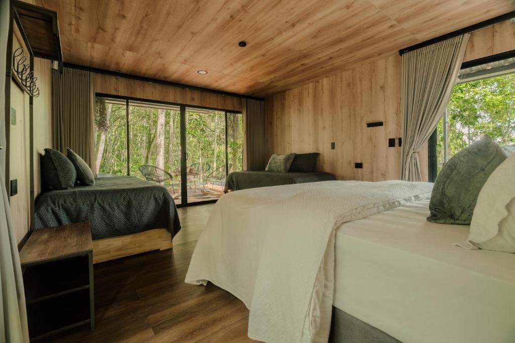 Postel nebo postele na pokoji v ubytování El Bosque - Lago Calima