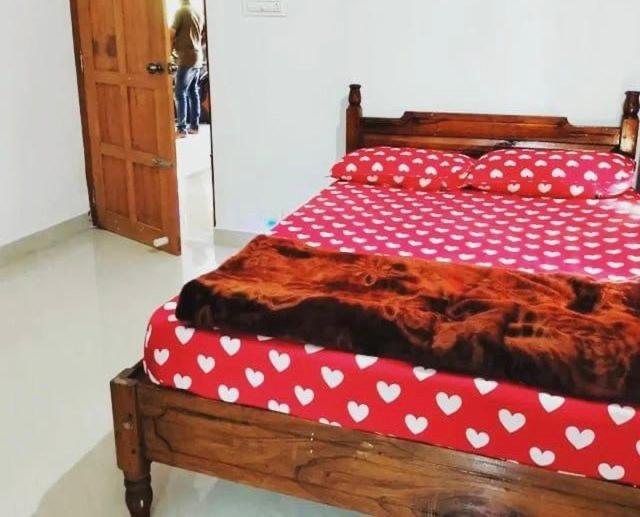Postel nebo postele na pokoji v ubytování Rima leisure Resort Suryanelli