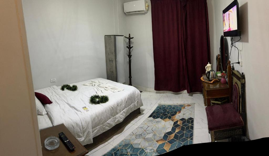 Postel nebo postele na pokoji v ubytování Pharaohs Oasis Hotel