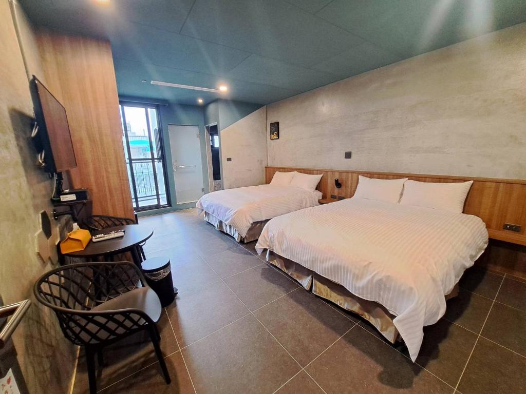 Postel nebo postele na pokoji v ubytování Chunfang Residence