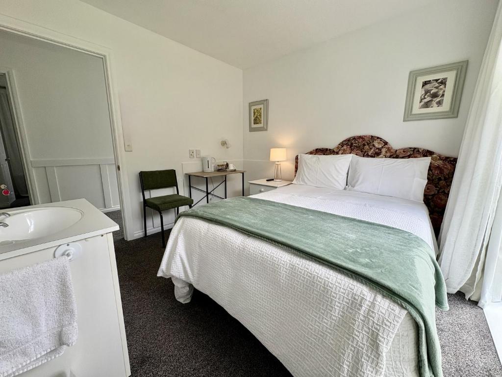 Postel nebo postele na pokoji v ubytování 64 Mandalea B&B