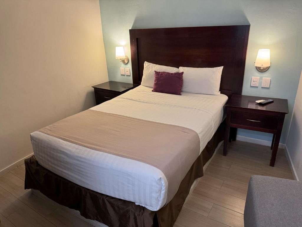 Postel nebo postele na pokoji v ubytování Hotel Arribo
