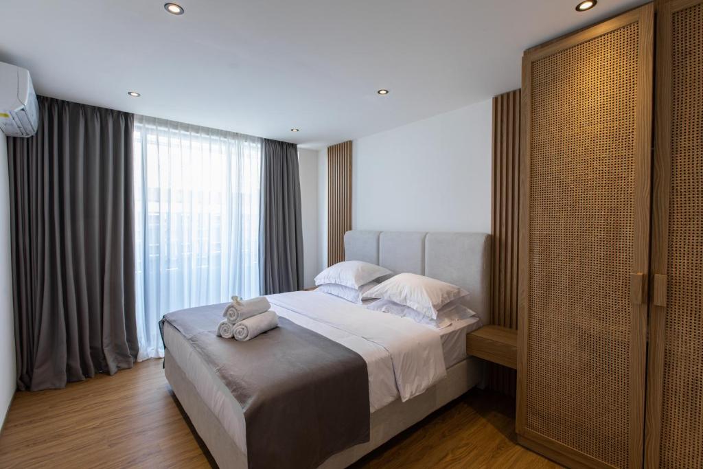 Postel nebo postele na pokoji v ubytování 20 Suites Umalas