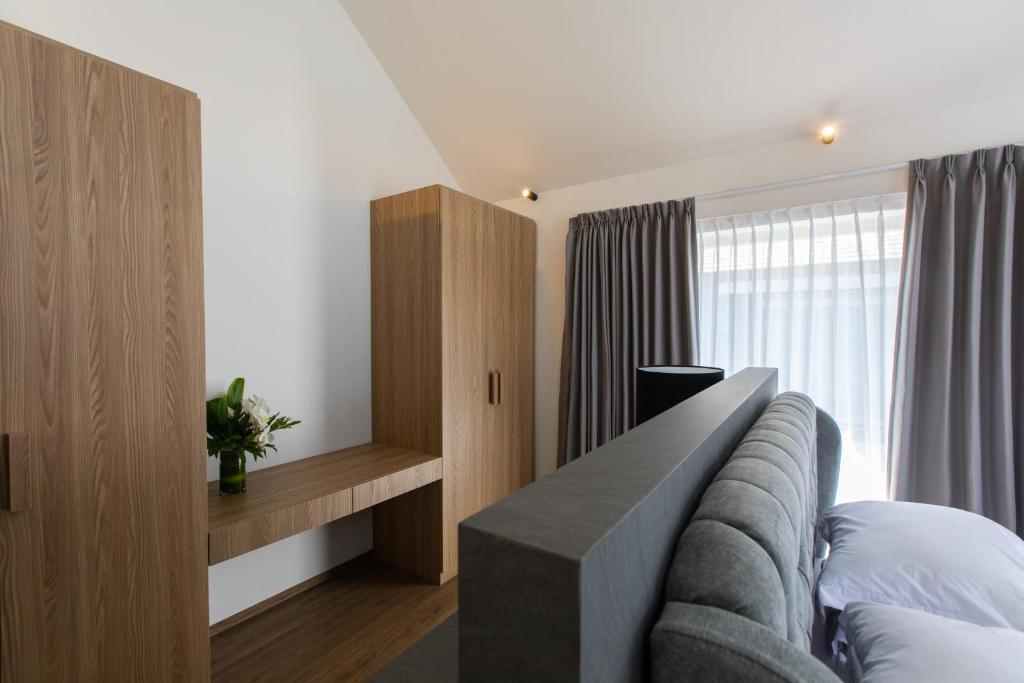 Postel nebo postele na pokoji v ubytování 20 Suites Umalas