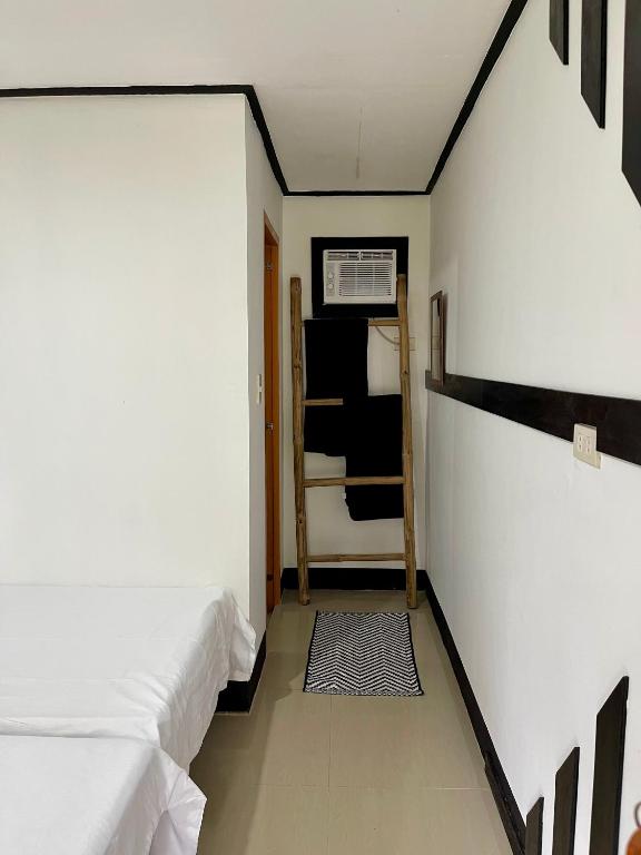 Postel nebo postele na pokoji v ubytování Nayon Inn