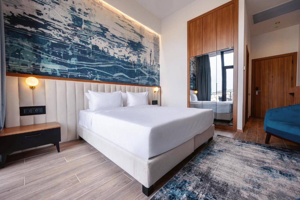 Postel nebo postele na pokoji v ubytování Kass Diamond Resort