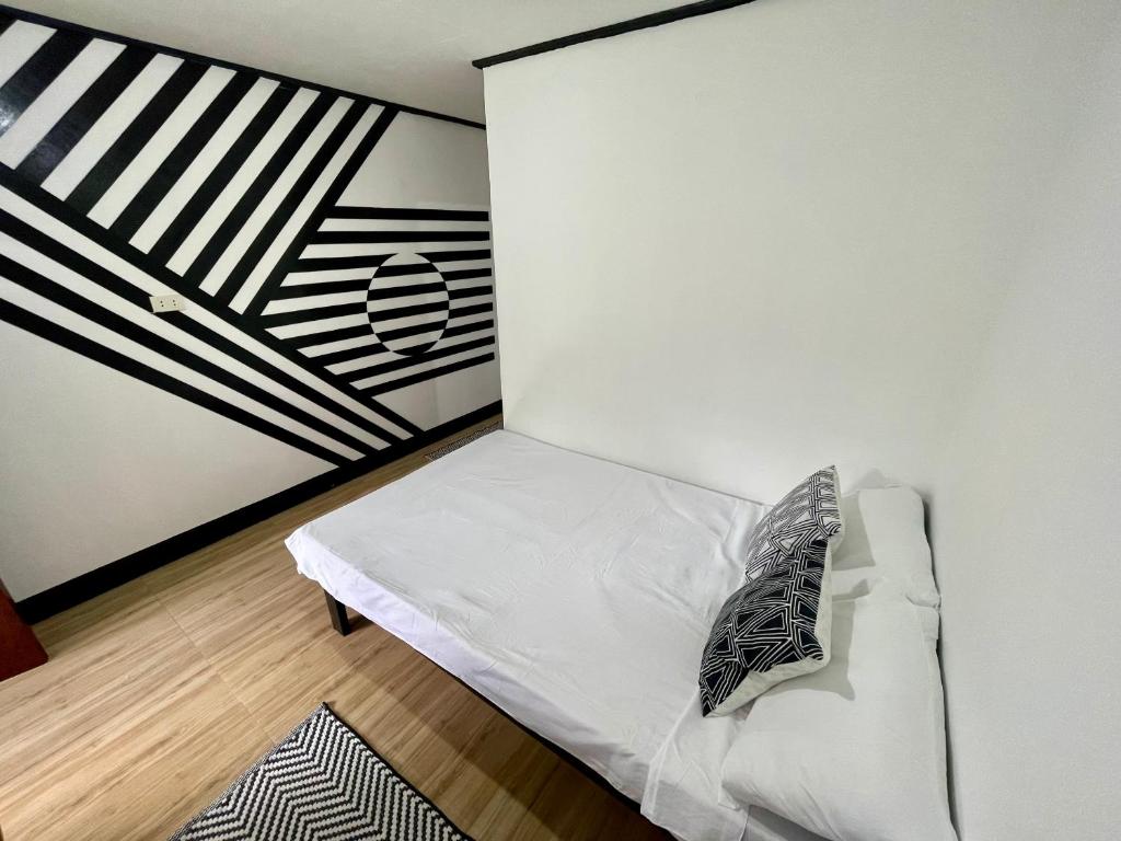 Postel nebo postele na pokoji v ubytování Nayon Inn
