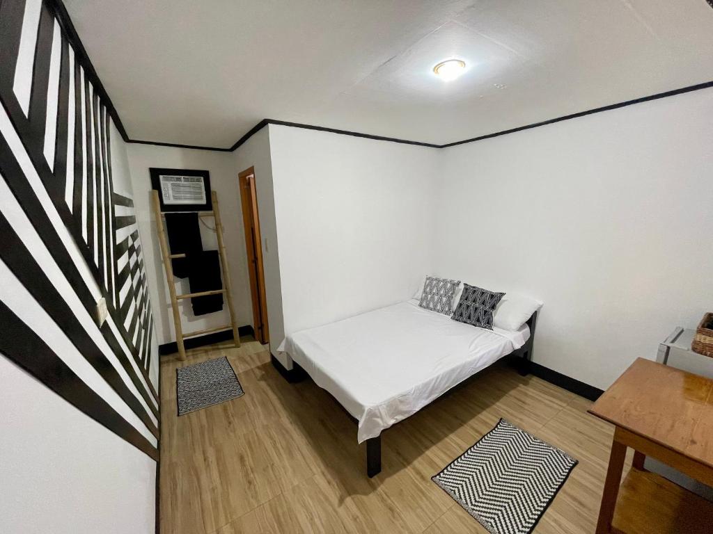 Postel nebo postele na pokoji v ubytování Nayon Inn