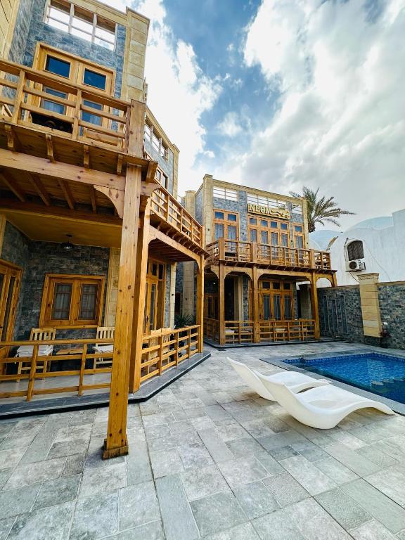 Bazén v ubytování NEOM DAHAB - - - - - - - - - - - Your new hotel in Dahab with private beach nebo v jeho okolí