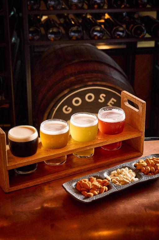 a wooden tray with different types of food on a table at FIVE Jumeirah Village in Dubai