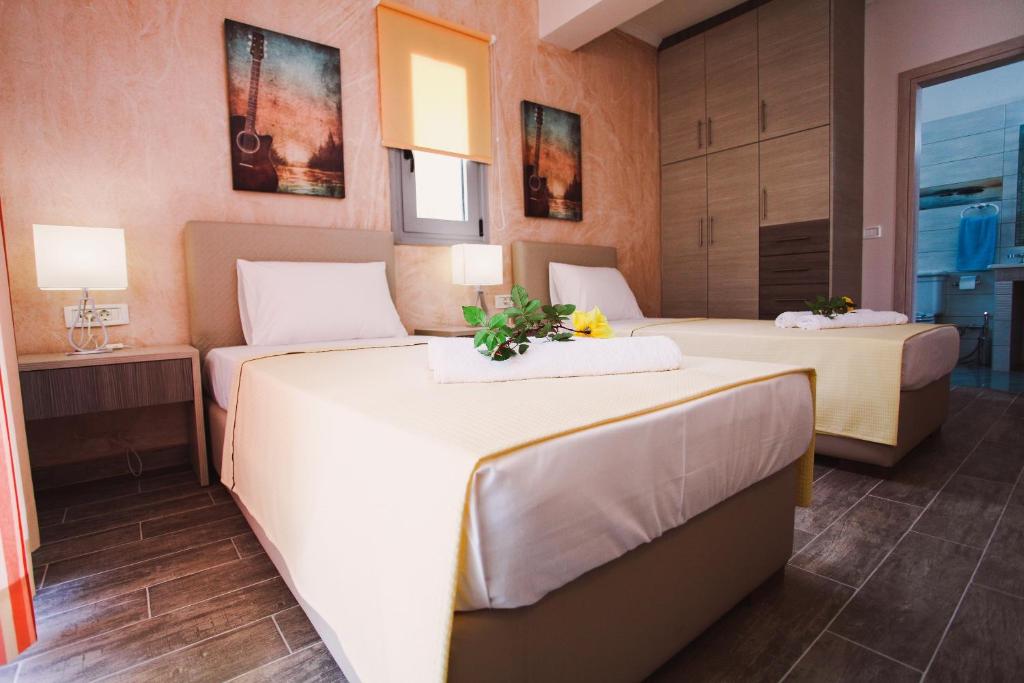 Postel nebo postele na pokoji v ubytování Ionian Diamond Villas