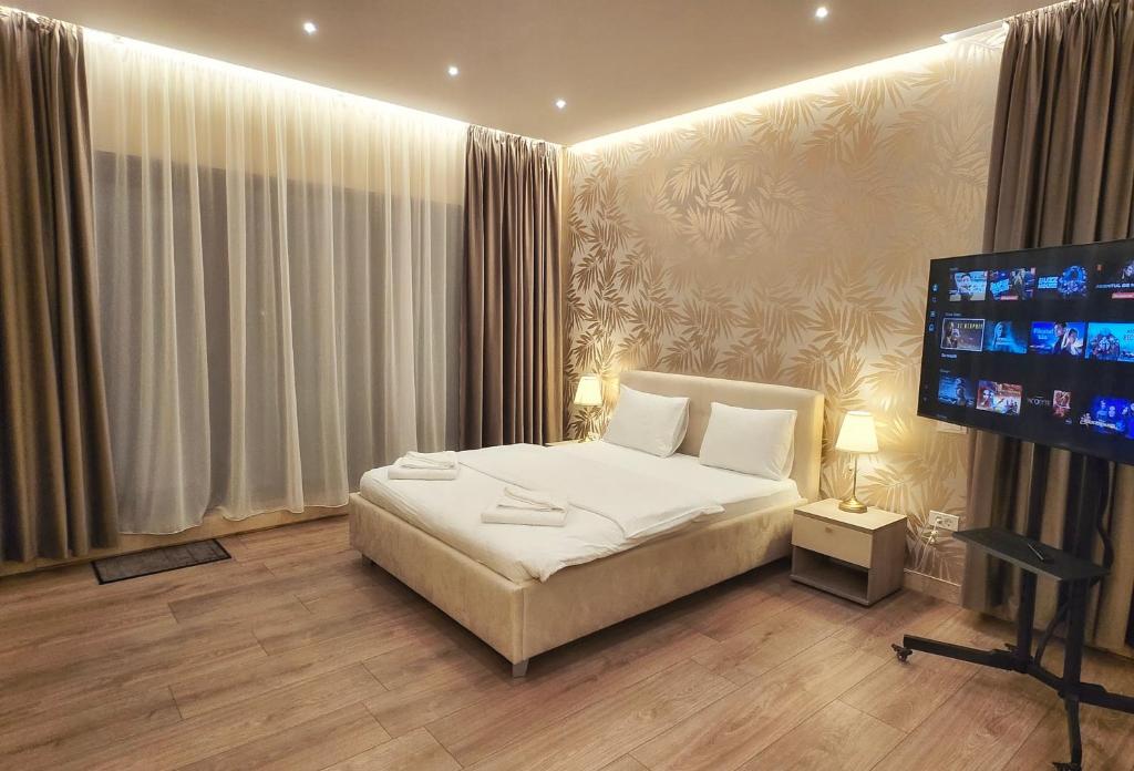 Postel nebo postele na pokoji v ubytování Monopoly Hotel