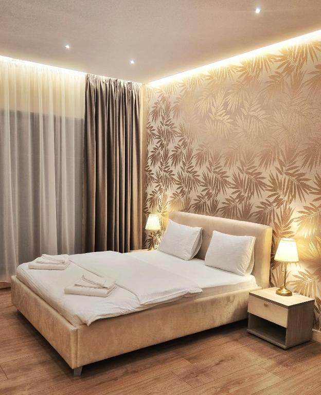 Postel nebo postele na pokoji v ubytování Monopoly Hotel