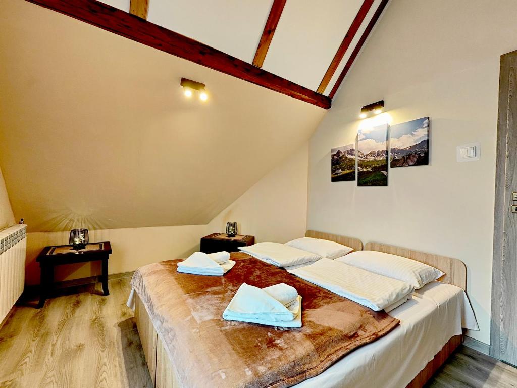 Postel nebo postele na pokoji v ubytování Apartamenty Rodzinne