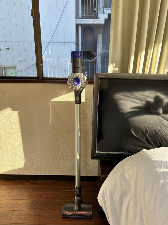 Postel nebo postele na pokoji v ubytování Ueno Sky Garden