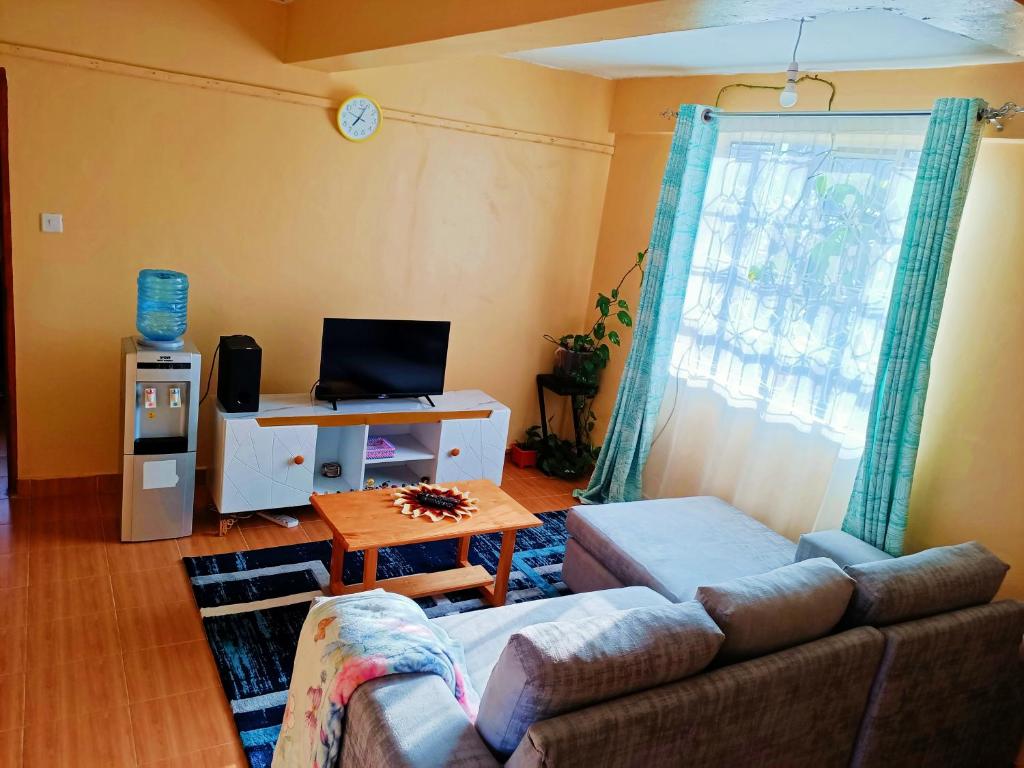 TV a/nebo společenská místnost v ubytování Dee's Place