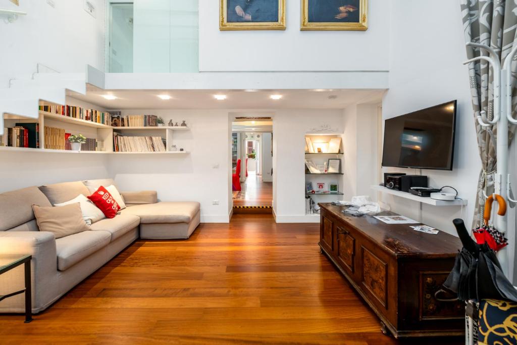 a living room with a couch and a table at Riccardo Luxury Apartment in Bari