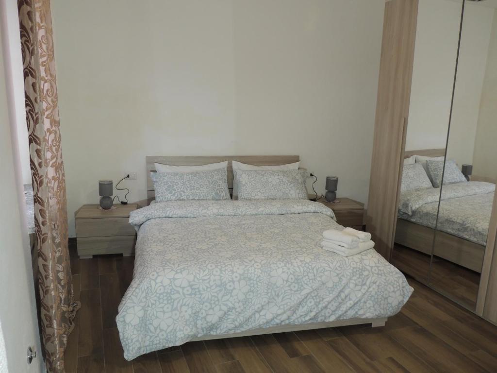 Katil atau katil-katil dalam bilik di Casa serenità "bilocale con ingresso indipendete"