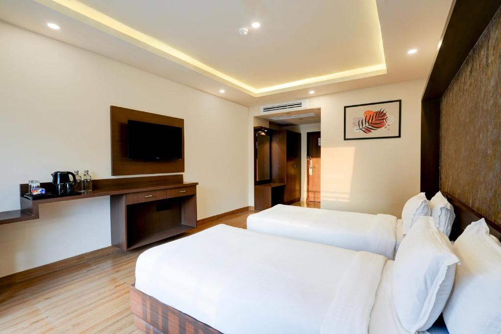 TV a/nebo společenská místnost v ubytování Hotel Aerotech Plaza