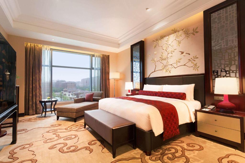 Postel nebo postele na pokoji v ubytování Wyndham Grand Xi'an Residence