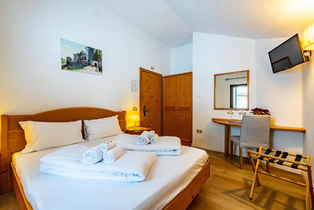 Postel nebo postele na pokoji v ubytování Hotel Grizzly