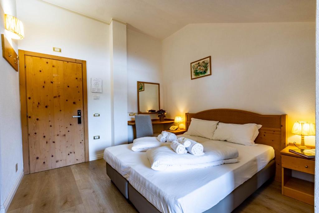 Postel nebo postele na pokoji v ubytování Hotel Grizzly