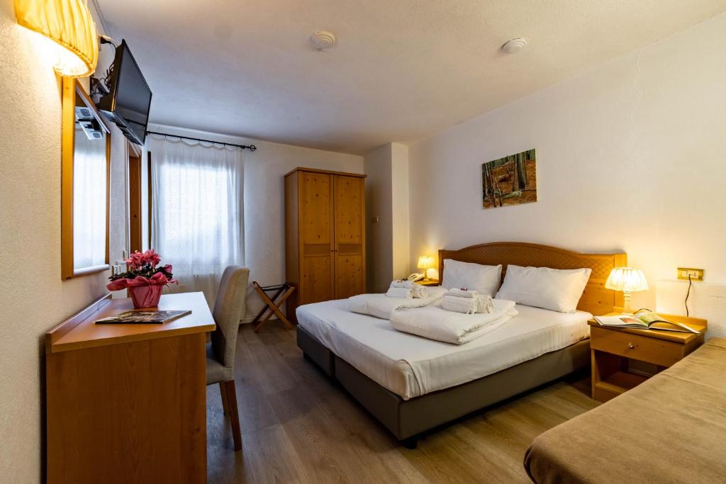 Postel nebo postele na pokoji v ubytování Hotel Grizzly