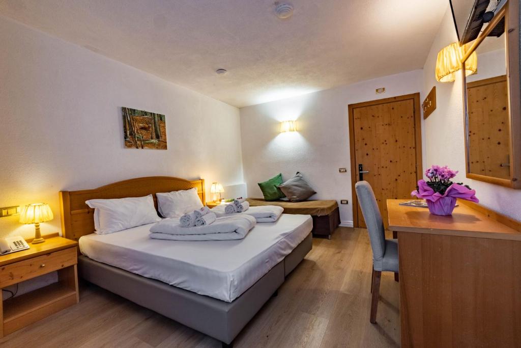 Postel nebo postele na pokoji v ubytování Hotel Grizzly