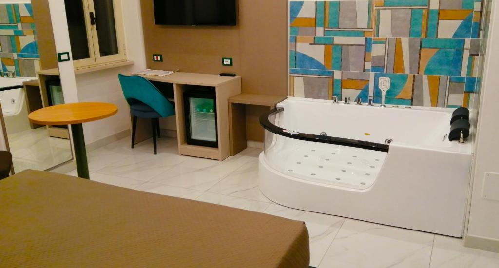 TV a/nebo společenská místnost v ubytování HOTEL HOUSE GARGANO