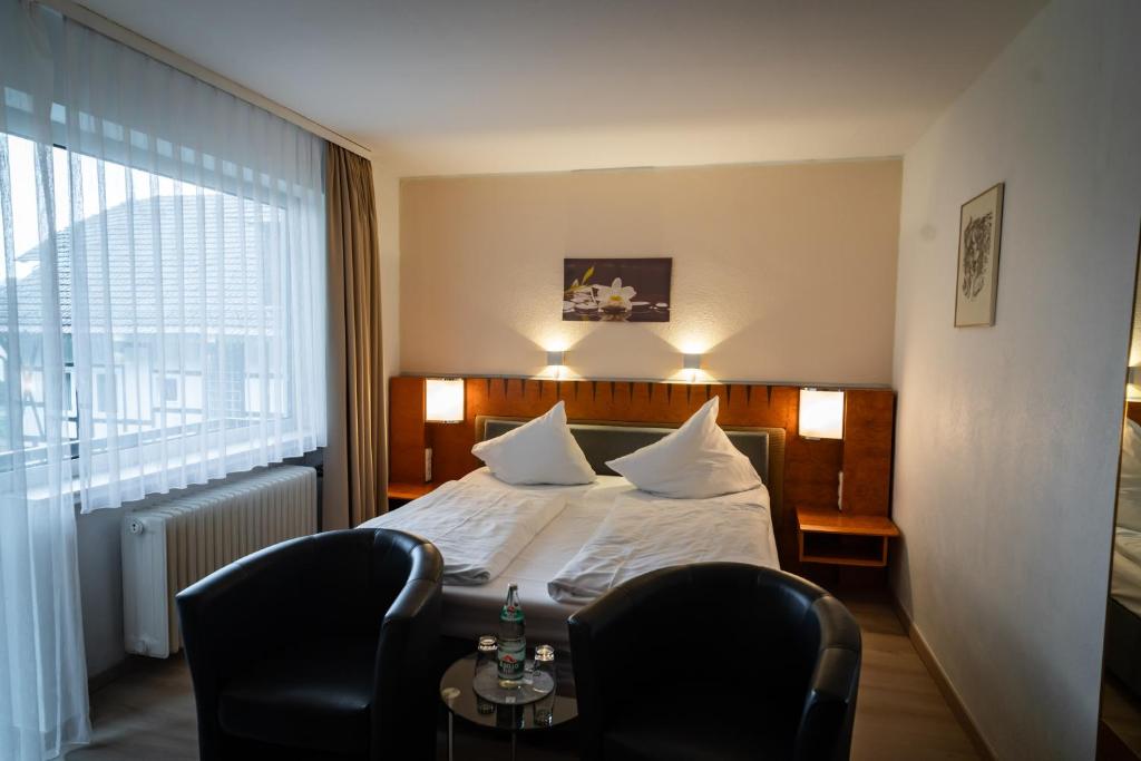 Postel nebo postele na pokoji v ubytování Hotel Martina