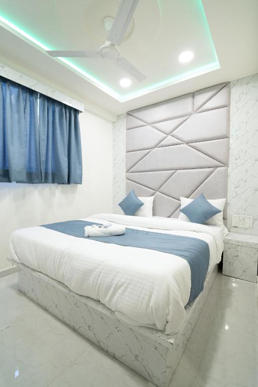 Postel nebo postele na pokoji v ubytování Hotel Nest Sky