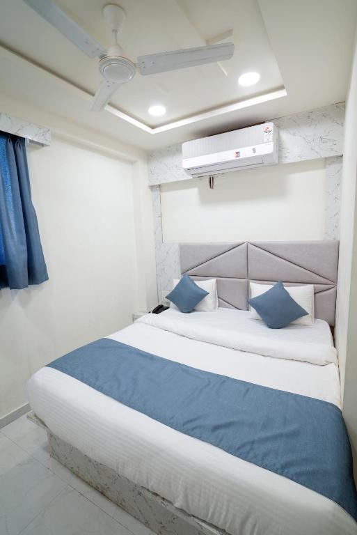 Postel nebo postele na pokoji v ubytování Hotel Nest Sky
