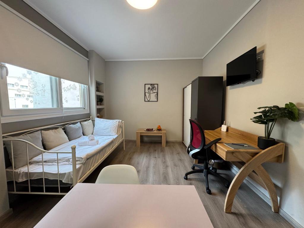 a small room with a bed and a desk at Work from home Project in Thessaloniki