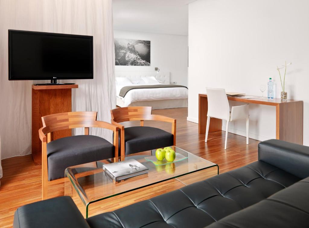 a living room with a couch and a table at Iberostar Heritage Grand Mencey in Santa Cruz de Tenerife