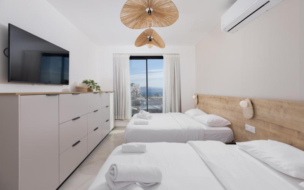 Ein Bett oder Betten in einem Zimmer der Unterkunft אורה דירות אירוח -נץ 9- דירות נופש איכותיות לנופש שקט ואקסלוסיבי