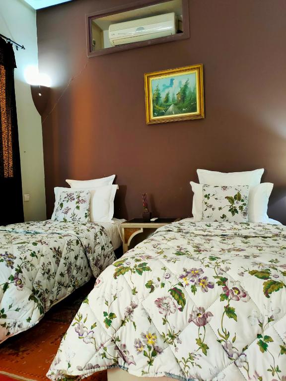 Postel nebo postele na pokoji v ubytování Riad shéhérazade Marrakech