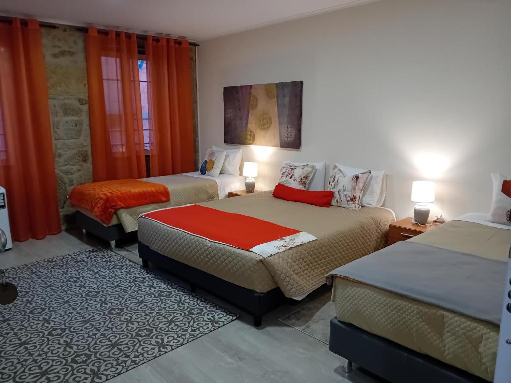 Postel nebo postele na pokoji v ubytování Rustic House Fundão