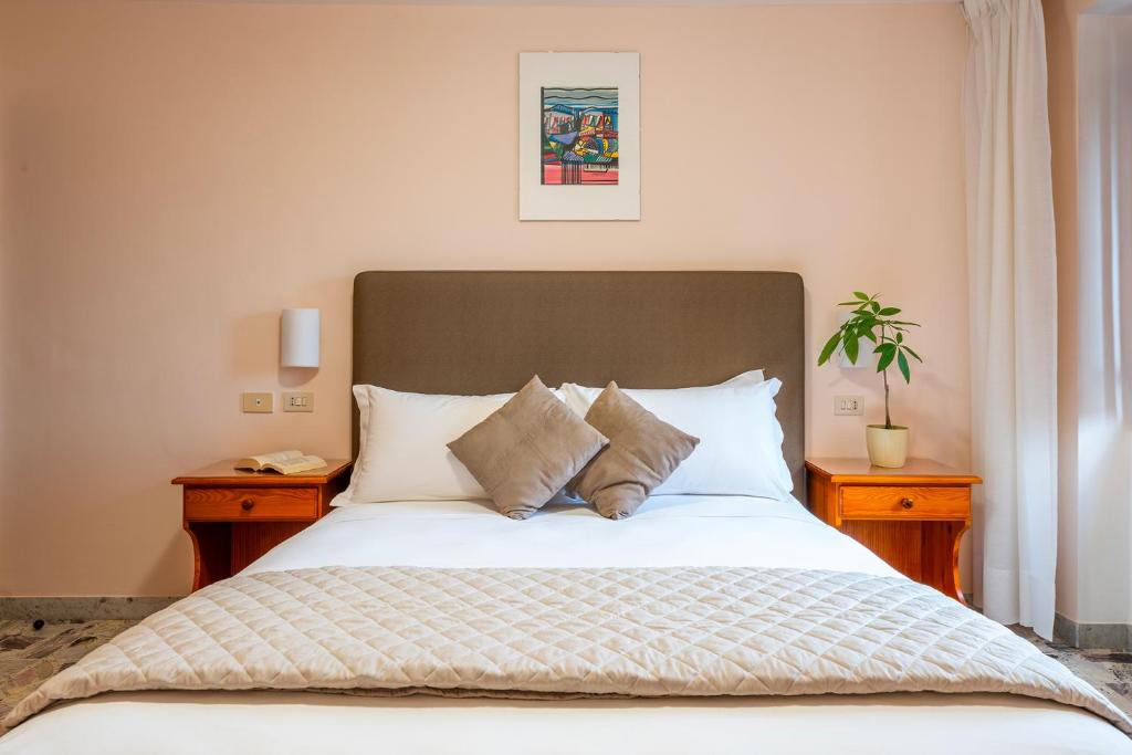 Postel nebo postele na pokoji v ubytování Hotel Iris