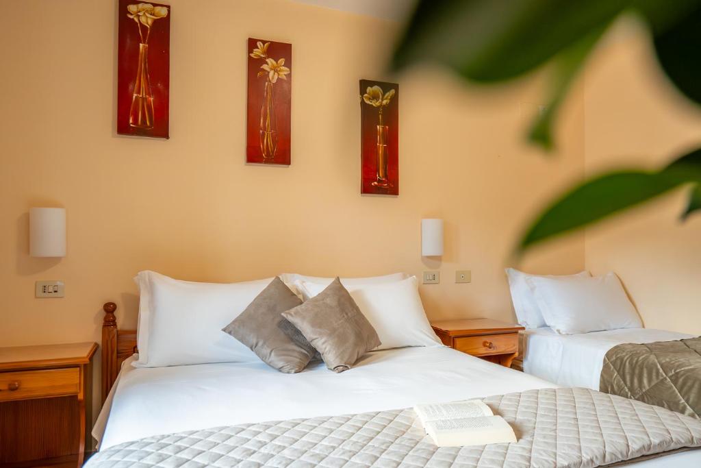 Postel nebo postele na pokoji v ubytování Hotel Iris