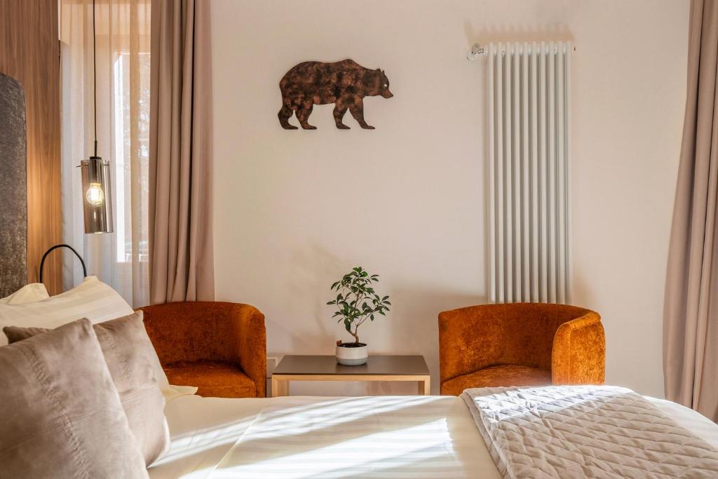 Postel nebo postele na pokoji v ubytování Hotel Iris