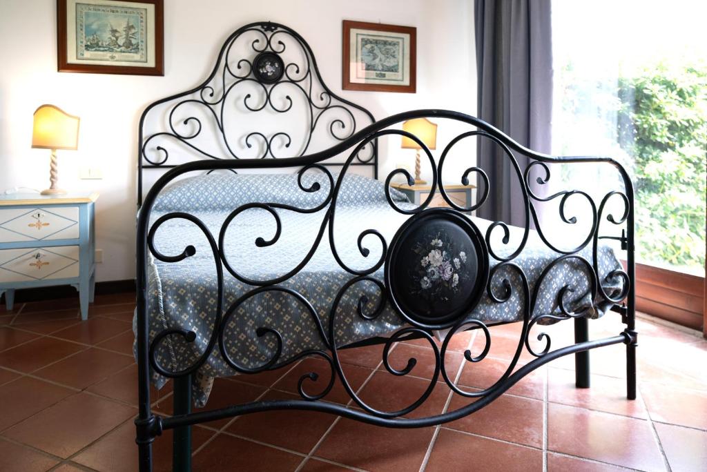 En eller flere senge i et værelse på Villa il Rosmarino