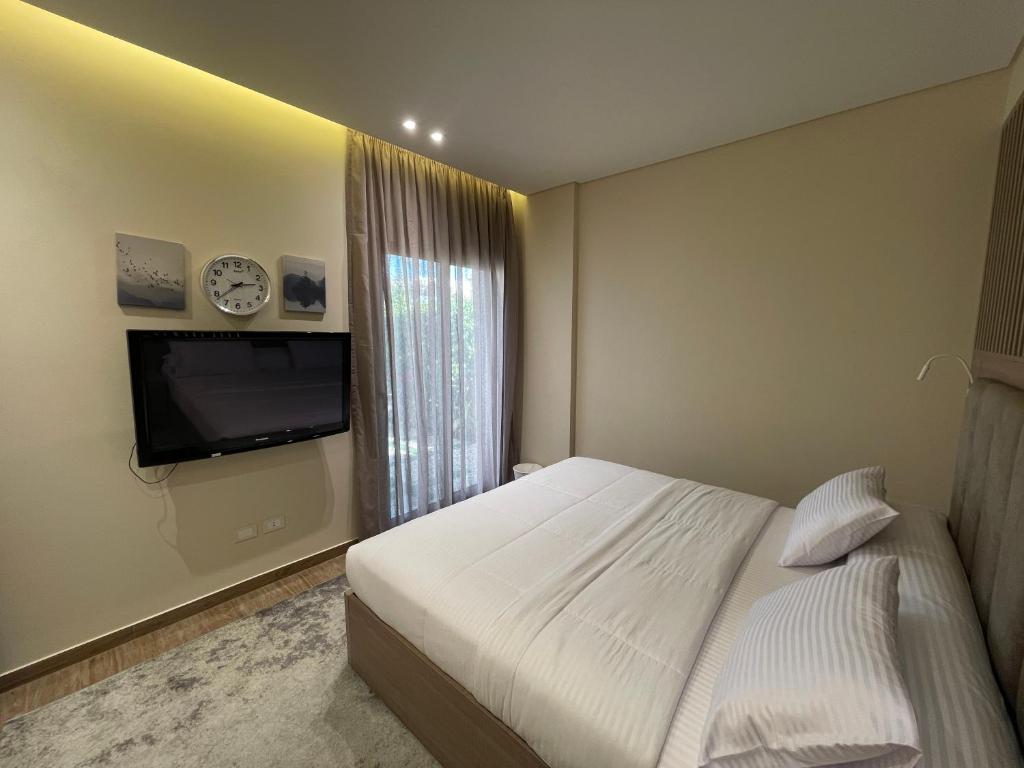 TV a/nebo společenská místnost v ubytování شقة فندقية الشيخ زايد - Zayed Suites C