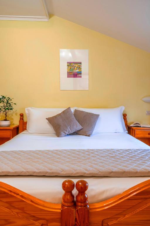 Postel nebo postele na pokoji v ubytování Hotel Iris
