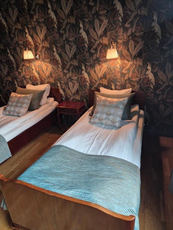Postel nebo postele na pokoji v ubytování Stora Hotellet Osby