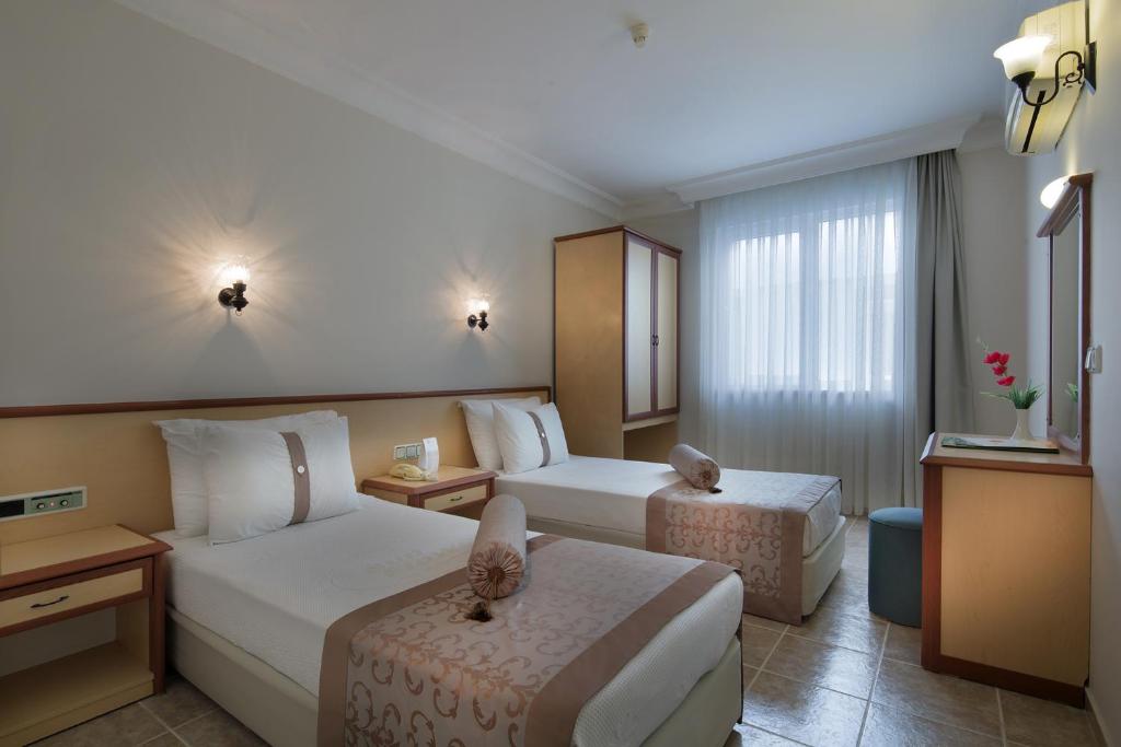 Postel nebo postele na pokoji v ubytování Villa Sunflower Hotel - All Inclusive
