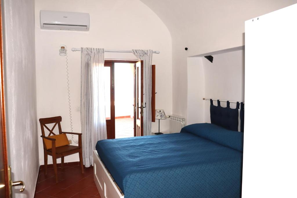 Postel nebo postele na pokoji v ubytování Casa Papuzza e Casa Lucilla