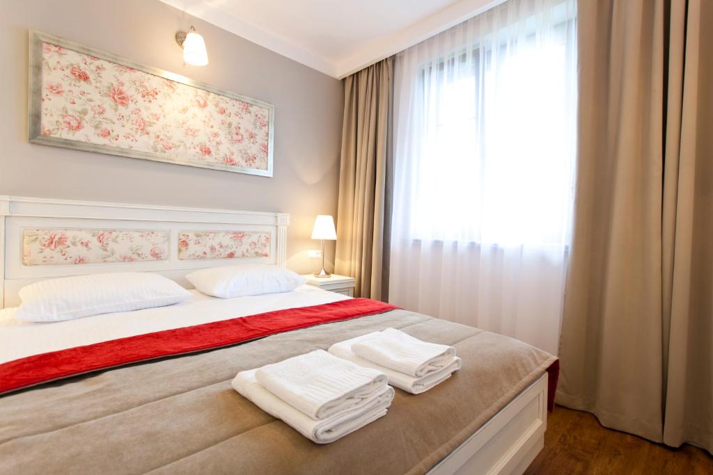 Postel nebo postele na pokoji v ubytování Perla Mare Apartamenty