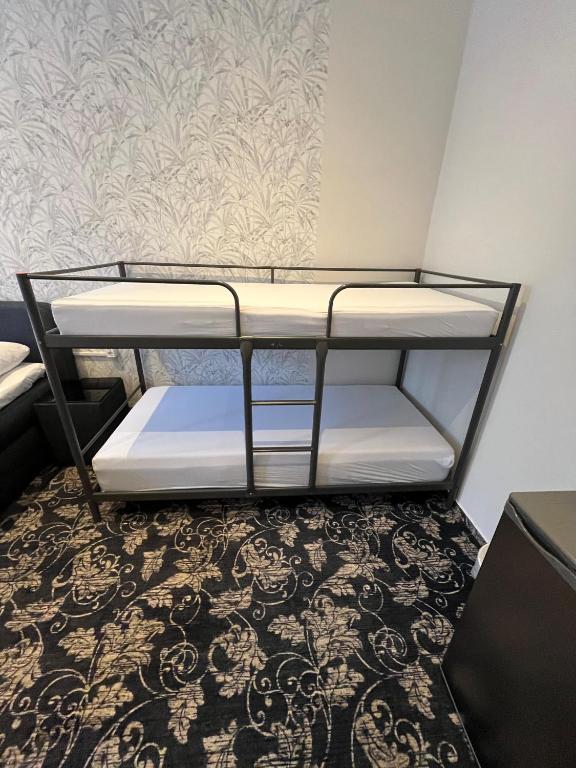 Postel nebo postele na pokoji v ubytování Hotel Gasteiner Hof